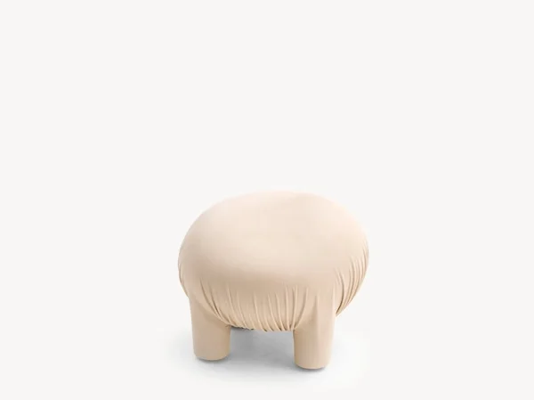 Anomaly Pouf by Moroso in undyed vegetal-tanned leather resembling a friendly creature, front view in a Royal Oak Michigan showroom