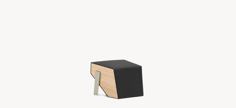 Silver Lake pouf by Moroso in mustard-yellow leather, trapezoidal form with polished steel legs, set in a mid‑century modern living room