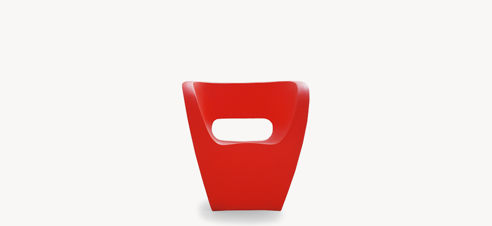 Orange Little Albert armchair by Ron Arad, showcasing its sculptural form and ergonomic curves.