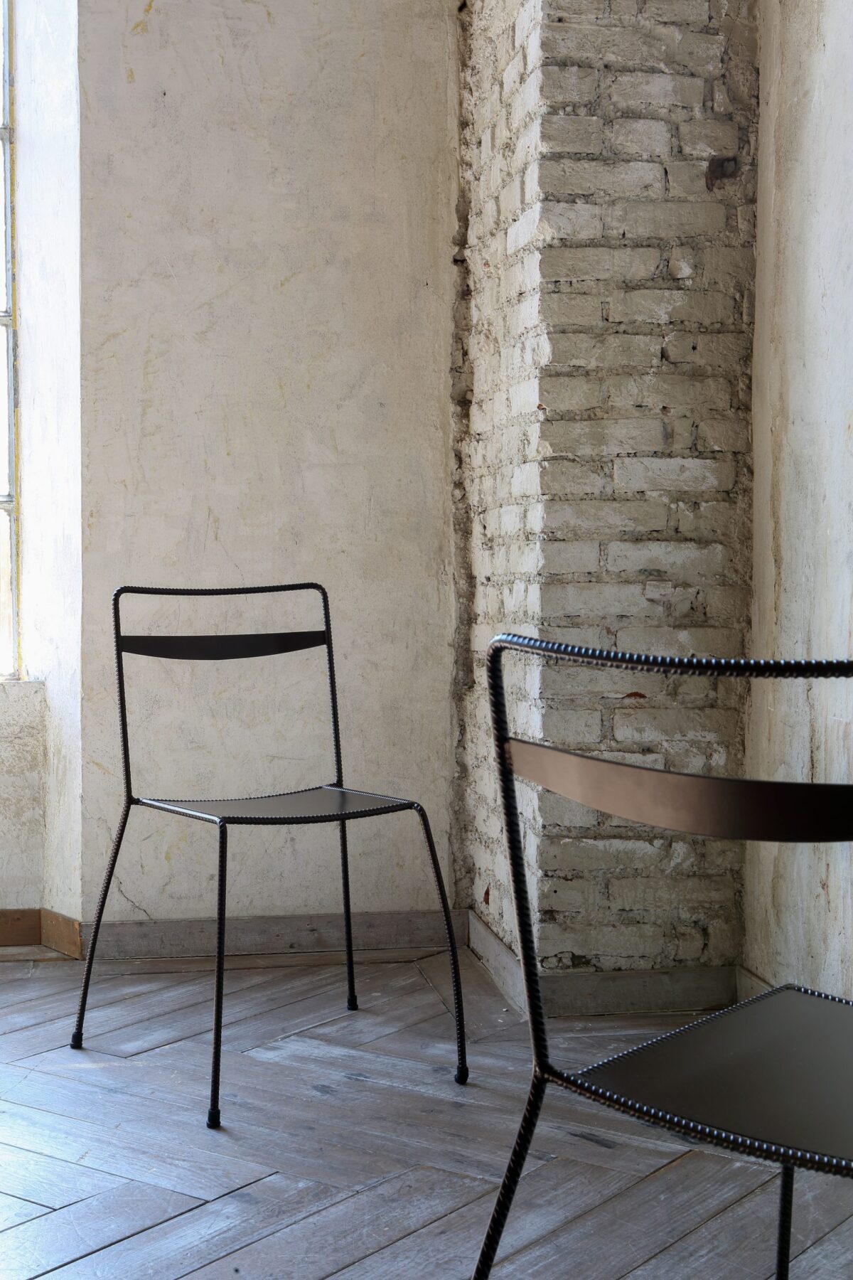 Side view of Tondella Chair featuring its stackable design and clean lines, suitable for both residential and commercial spaces.