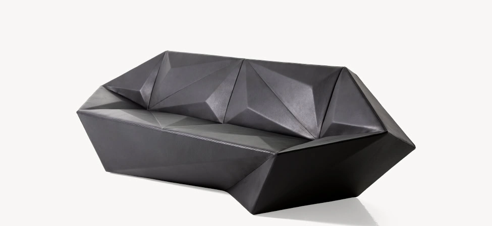 Gemma Sofa by Moroso side angle highlighting tufted back cushions and modern low-slung form in a Troy Michigan setting