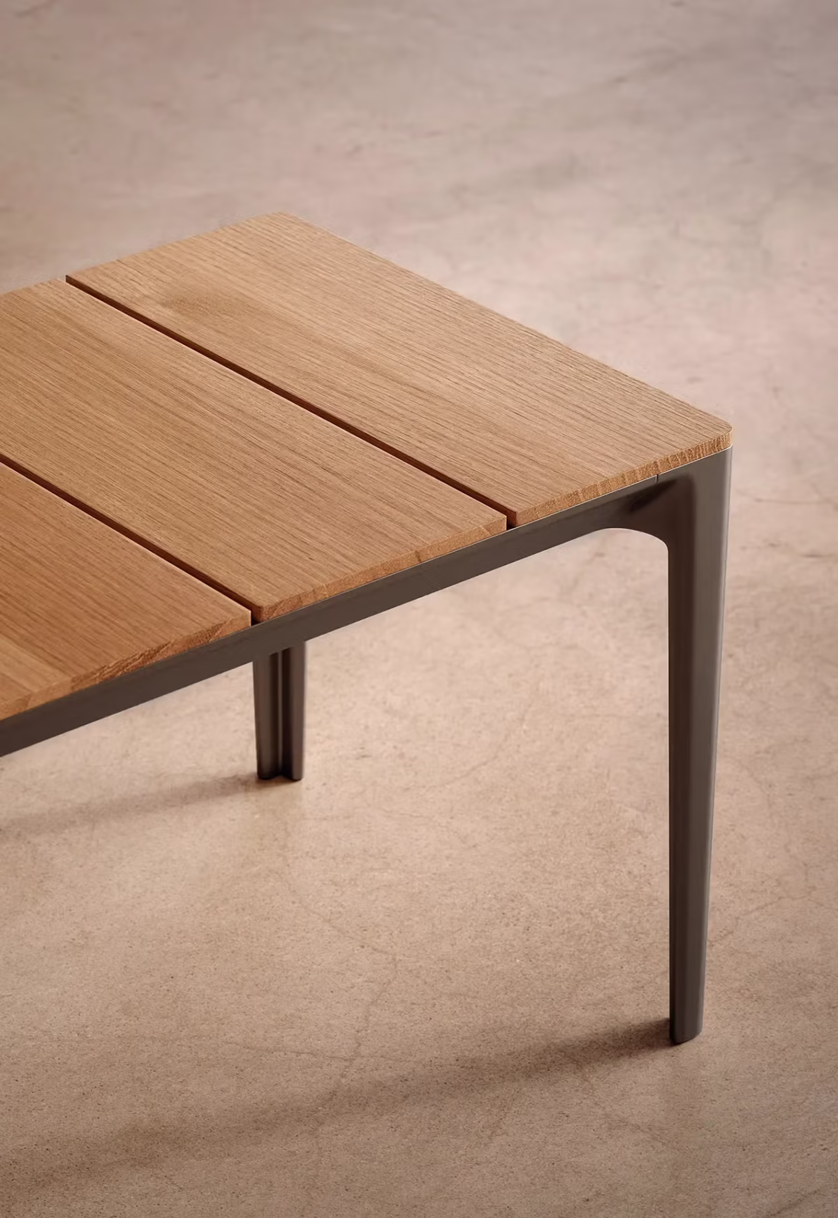 Contemporary outdoor space featuring Outdoor Able Bench by Bensen beside a matching dining table