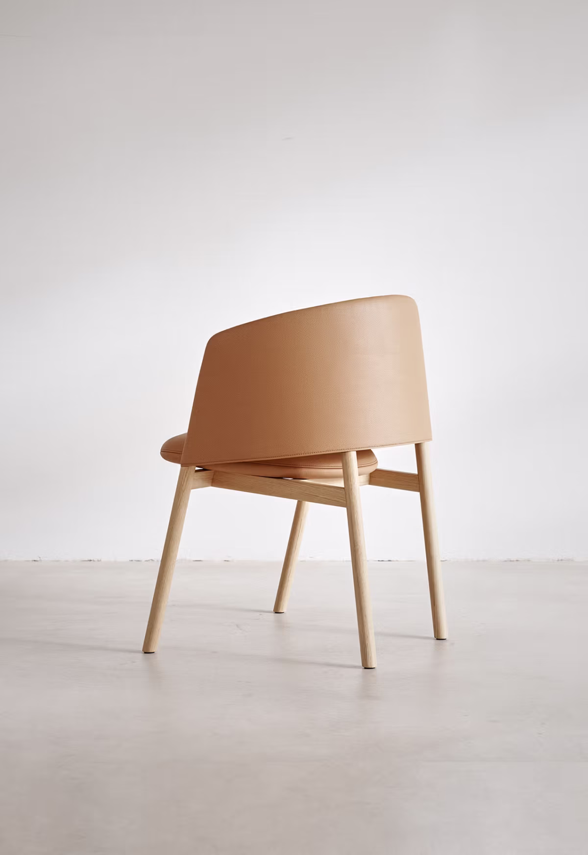 Close-up of the Collar Dining Chair’s flexible polyurethane seat and ergonomic design.
