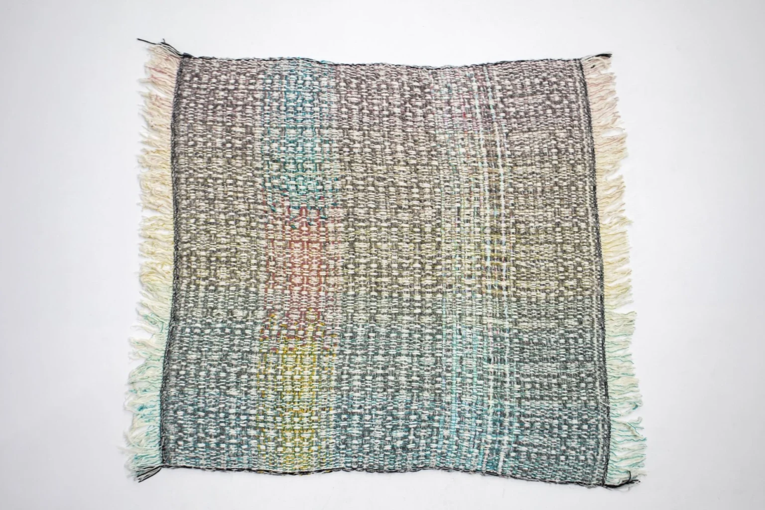 7Plaids Throw by Moroso side profile highlighting hand‑loomed selvedges in a Troy Michigan living space