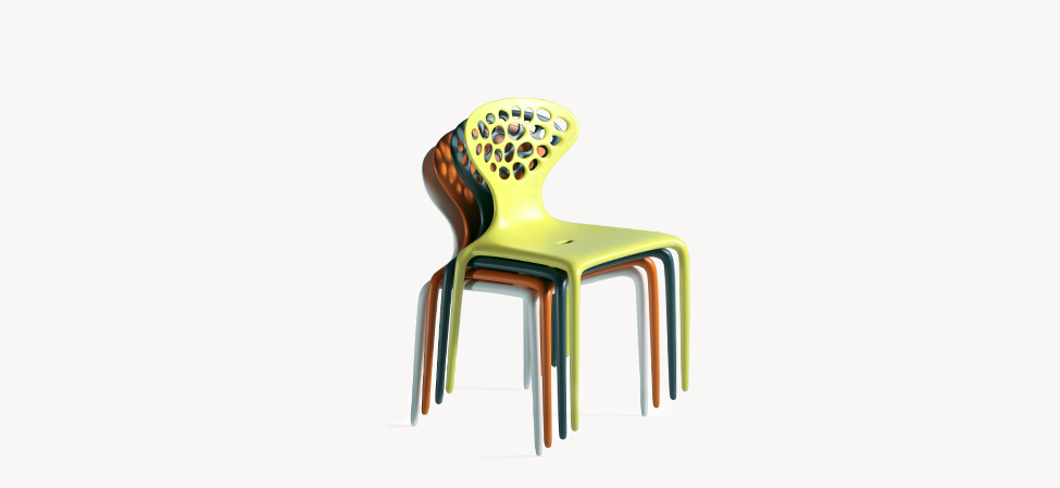 Supernatural chair by Moroso in vibrant lime green, featuring a perforated backrest and sleek plastic form
