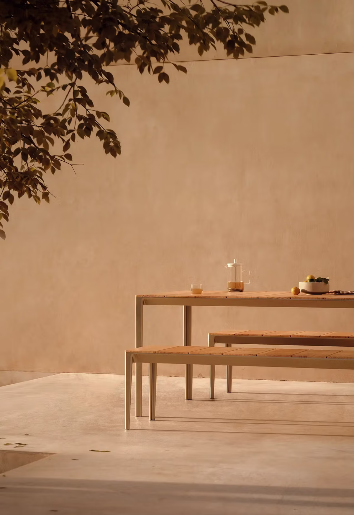 Side view of Outdoor Able Bench by Bensen showcasing its minimalist silhouette and slim legs