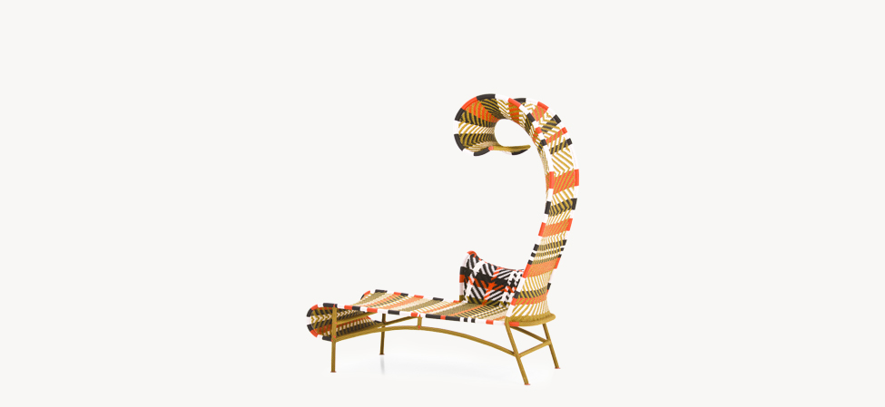 Shadowy Chaise Longue by Moroso in vibrant Multired pattern, featuring a sculptural high backrest and curved armrest.