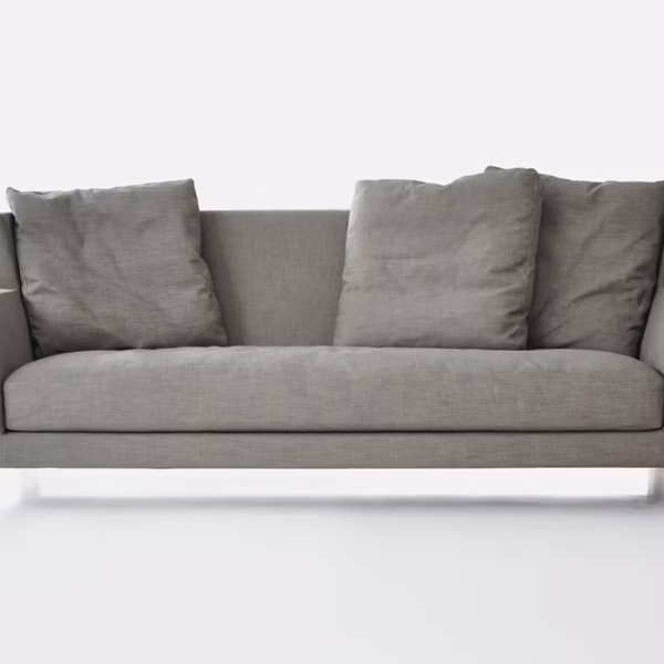 Morgan by Bensen lounge chair in soft beige fabric with rounded backrest and black metal legs in a modern living room