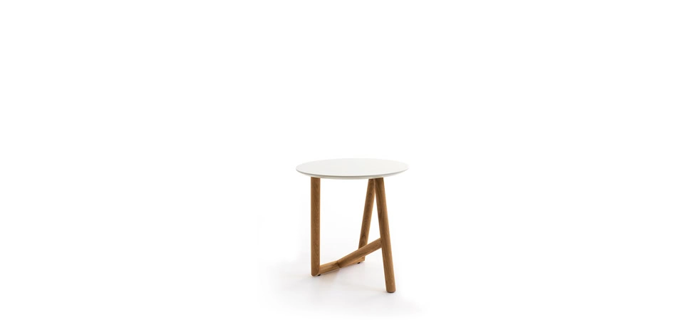 Klara Coffee Table by Moroso featuring round glass top and cylindrical marble base, front view in a Royal Oak Michigan showroom