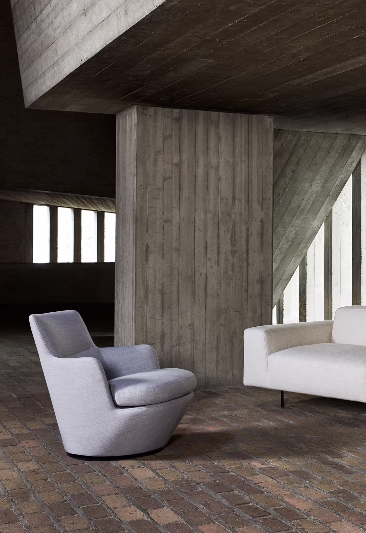Contemporary living room featuring Lo Turn by Bensen in beige upholstery paired with a minimalist side table