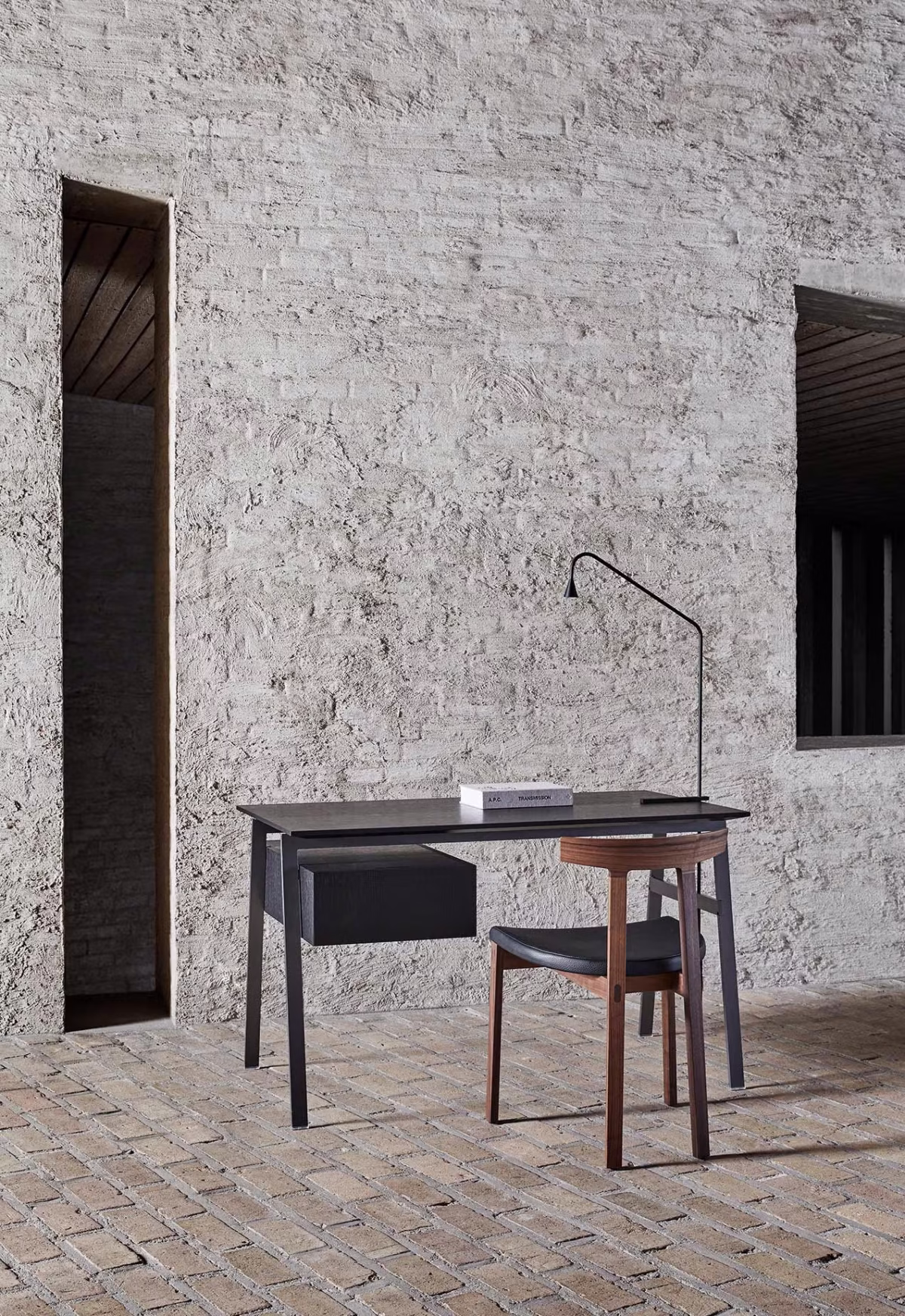Contemporary home office setup with Homework Wood Top desk by Bensen paired with a comfortable chair and desk lamp