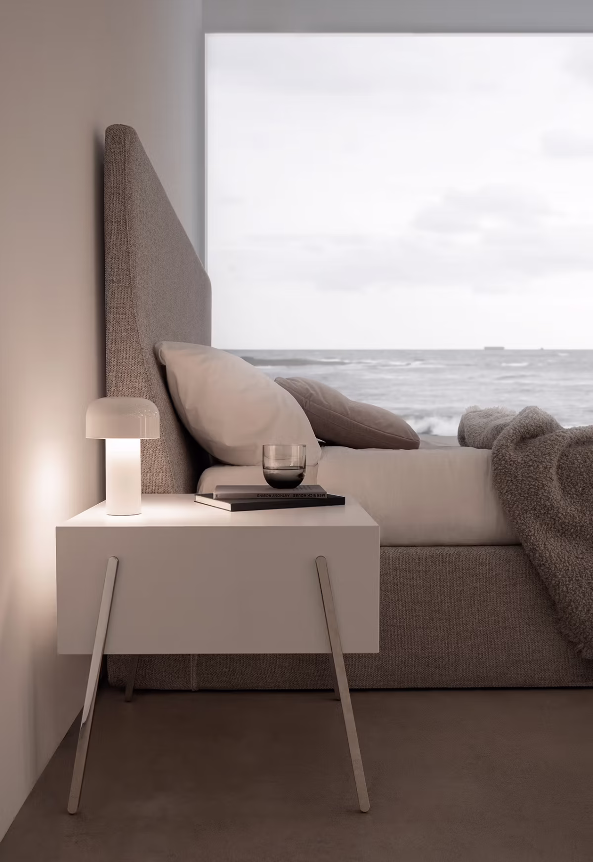 Cozy reading nook with Into by Bensen lounge chair, soft throw, and natural light