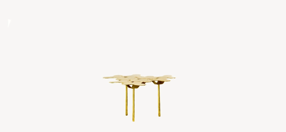 Nanook Coffee Table by Moroso in glossy white enamel with hexagonal sheet-steel top, front view in a Royal Oak Michigan showroom