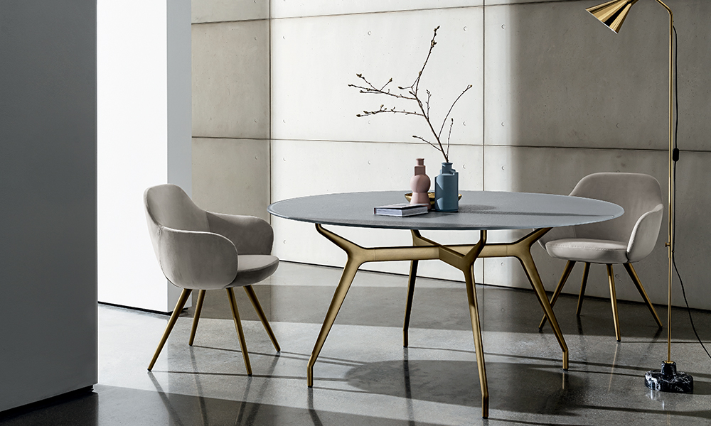 “Arkos Round Table by Sovet – sleek minimalist Italian design with soft geometric silhouette”