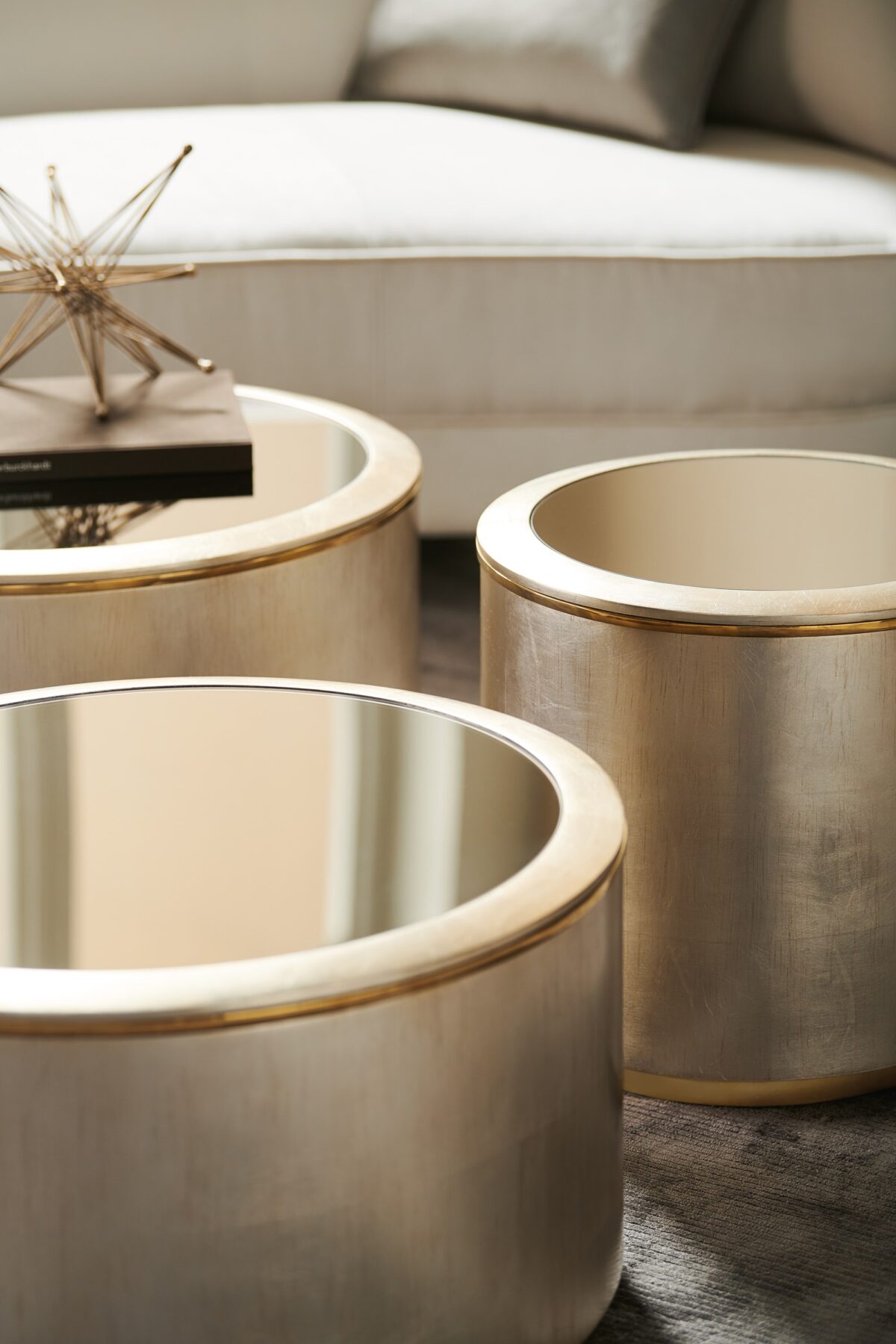 Elegant circular table featuring a textured finish and architectural pedestal design.