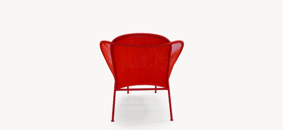 Imba by Moroso lounge chair with multicolor handwoven rope and powder-coated steel frame in a modern patio setting