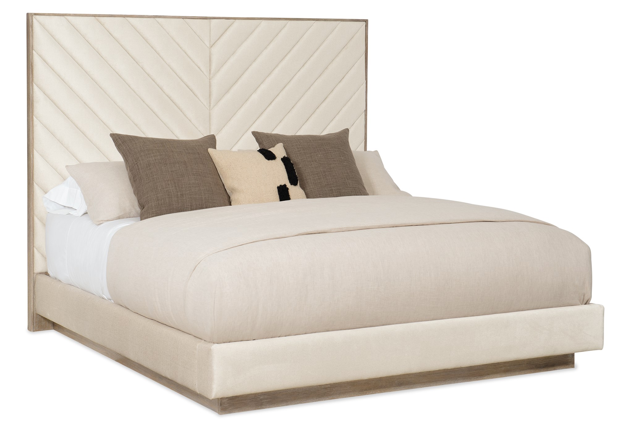 Caracole Meet U in the Middle King Bed featuring a fully upholstered frame with a chevron-patterned headboard, complemented by Ash Driftwood wood trim and a plinth base.