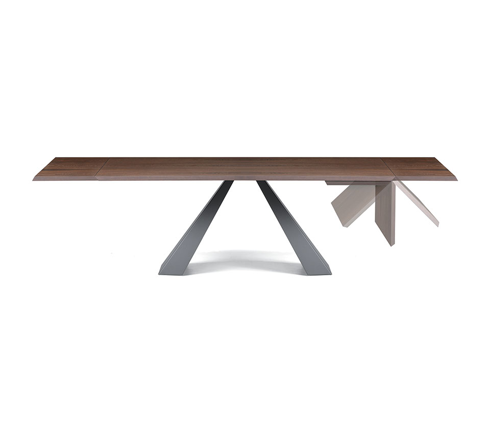 “Angled view of ELIOT Wood Drive by Cattelan Italia – contemporary dining table blending natural wood finish with bold base design"