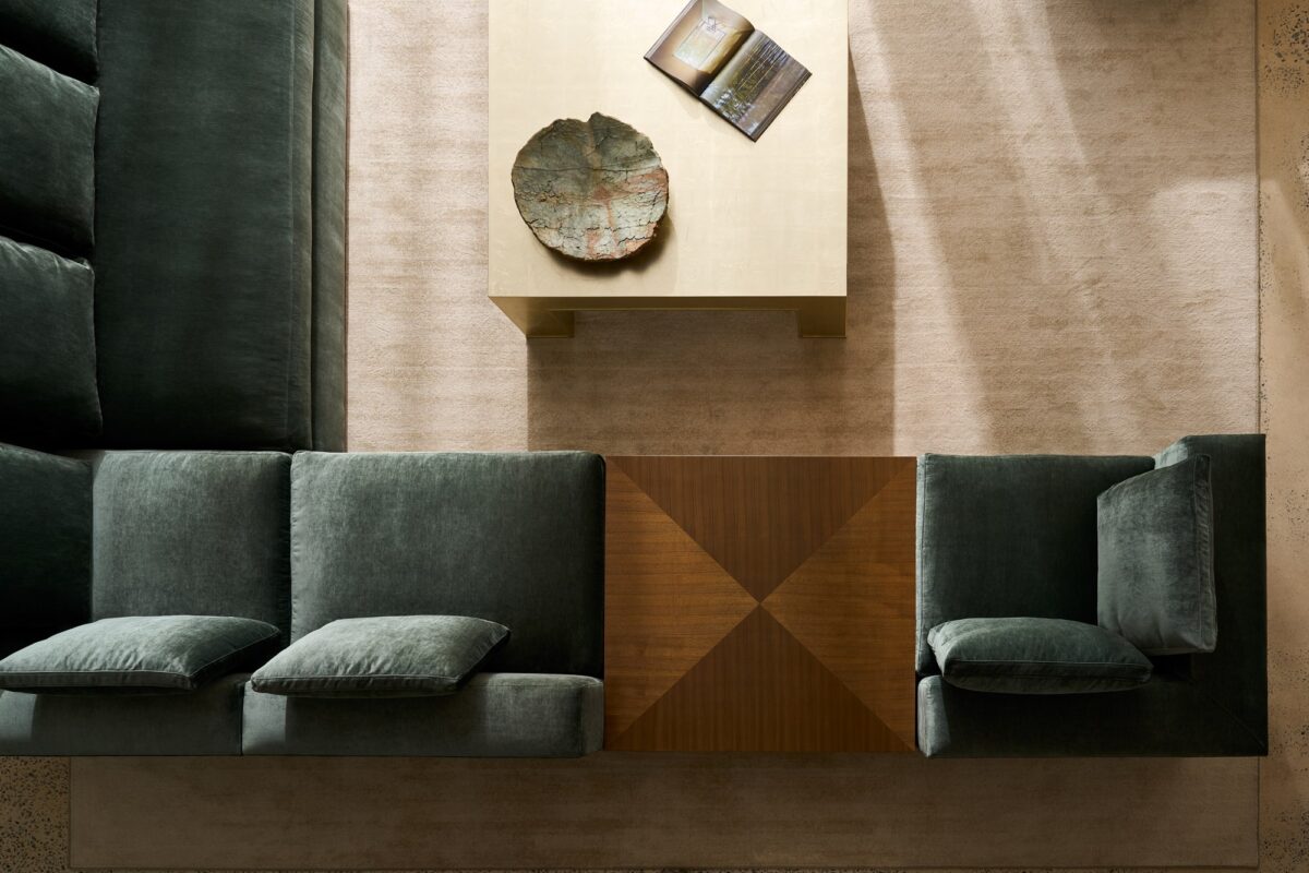 Front view of the Dorado table showcasing its open, airy design and luxe materials.