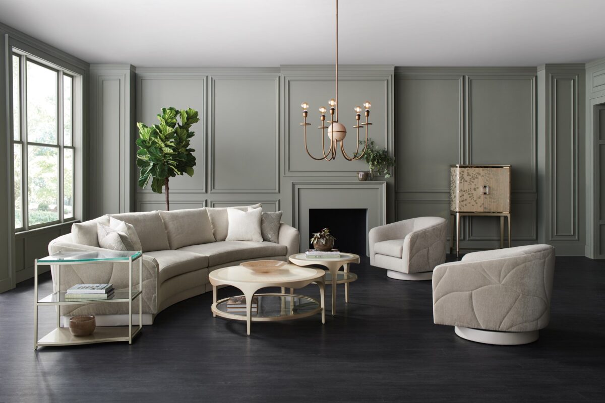 Contemporary side table featuring a sleek top and intersecting angular legs in rich wood finish.
