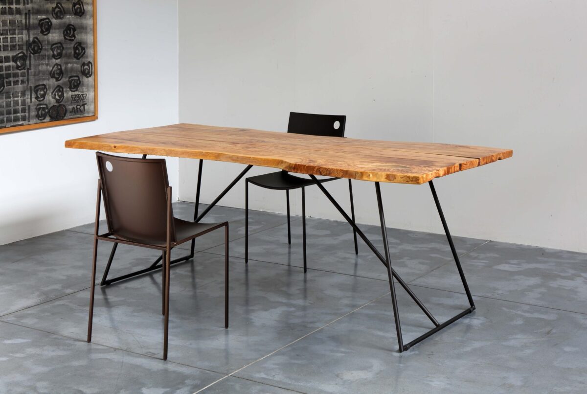 AURORA Chair in metal brown finish with ergonomic perforated seat and backrest, set against a bright contemporary room background.