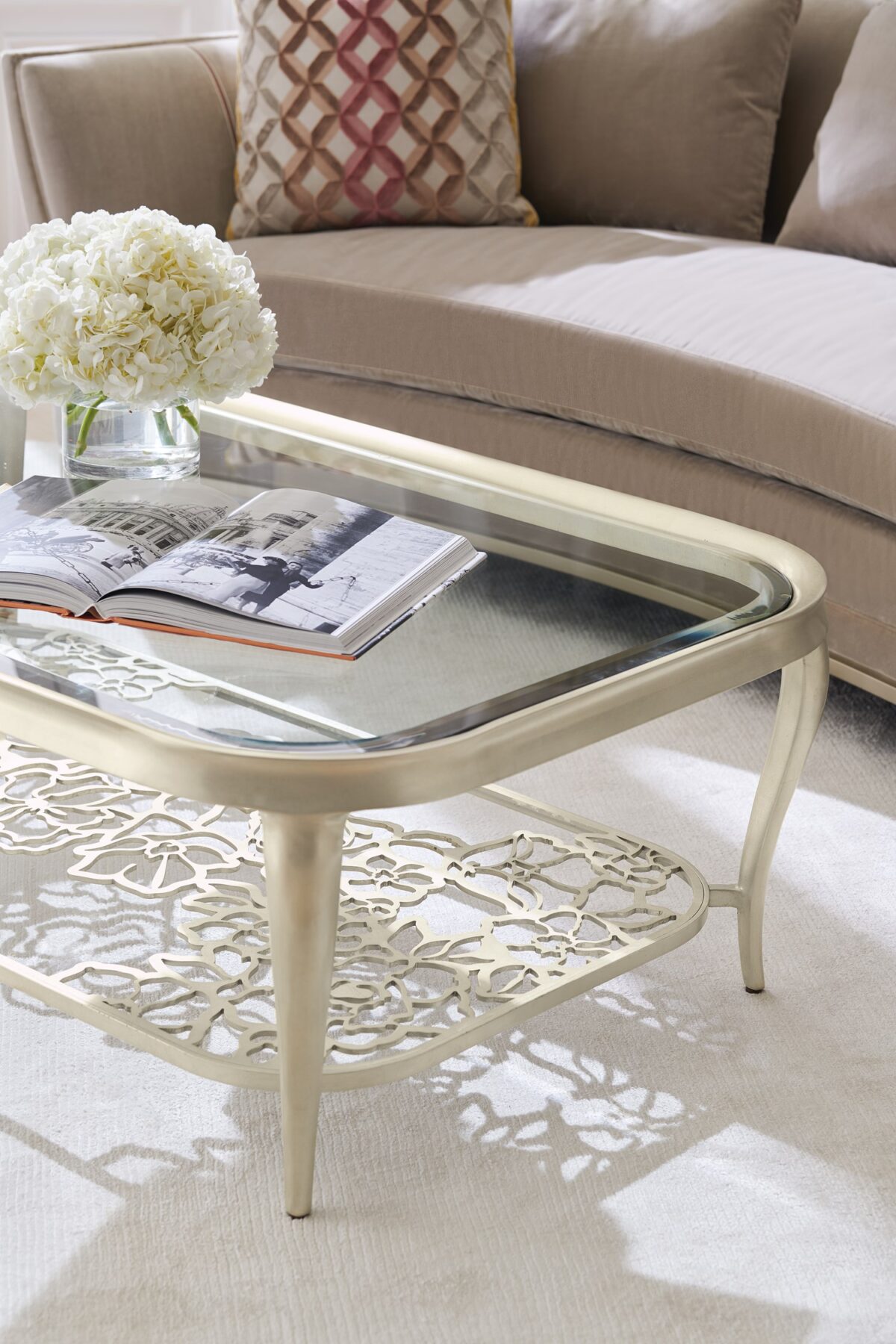 Artistic side table featuring a carved base resembling blooming petals in a natural wood finish.