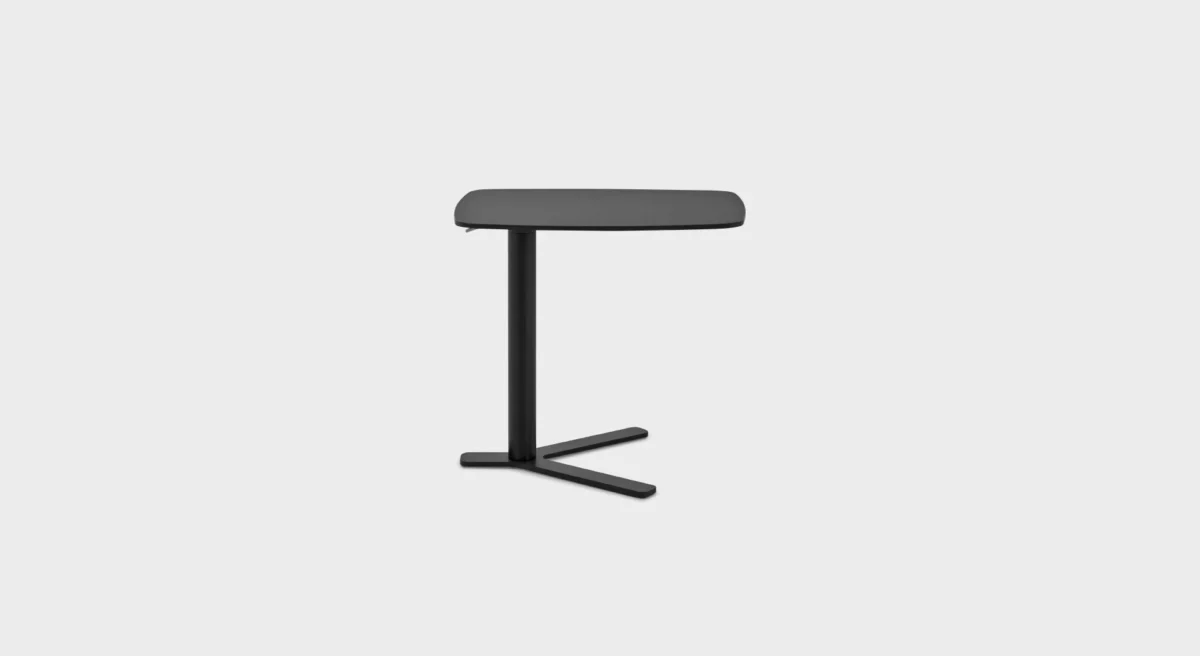 “Front angle of T80 E table showing its rectangular proportions and sturdy legs, placed next to a sofa in a minimalist interior.”