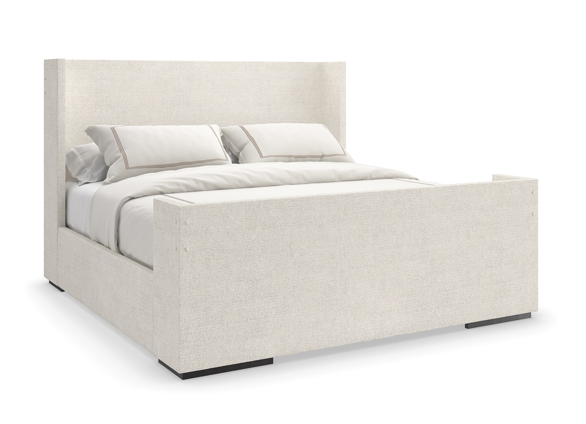 Caracole Shelter Me King Bed featuring a soft chenille upholstered headboard, footboard, and side rails, complemented by decorative buttons and a plinth base in Almost Black finish.