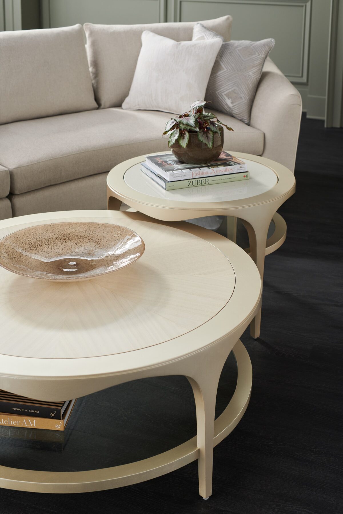 Down and Under by Caracole — a modern side table with layered surfaces and a sculptural wood base.