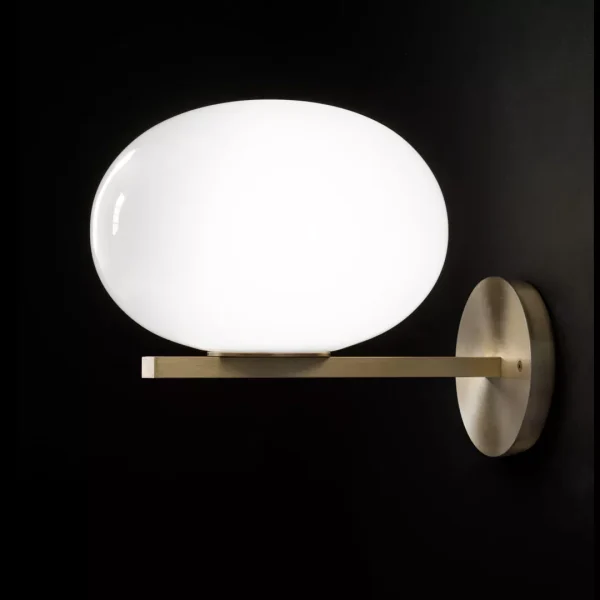 “Alba by Oluce modern Italian table lamp – opaline glass globe with brushed metal base and soft ambient light”