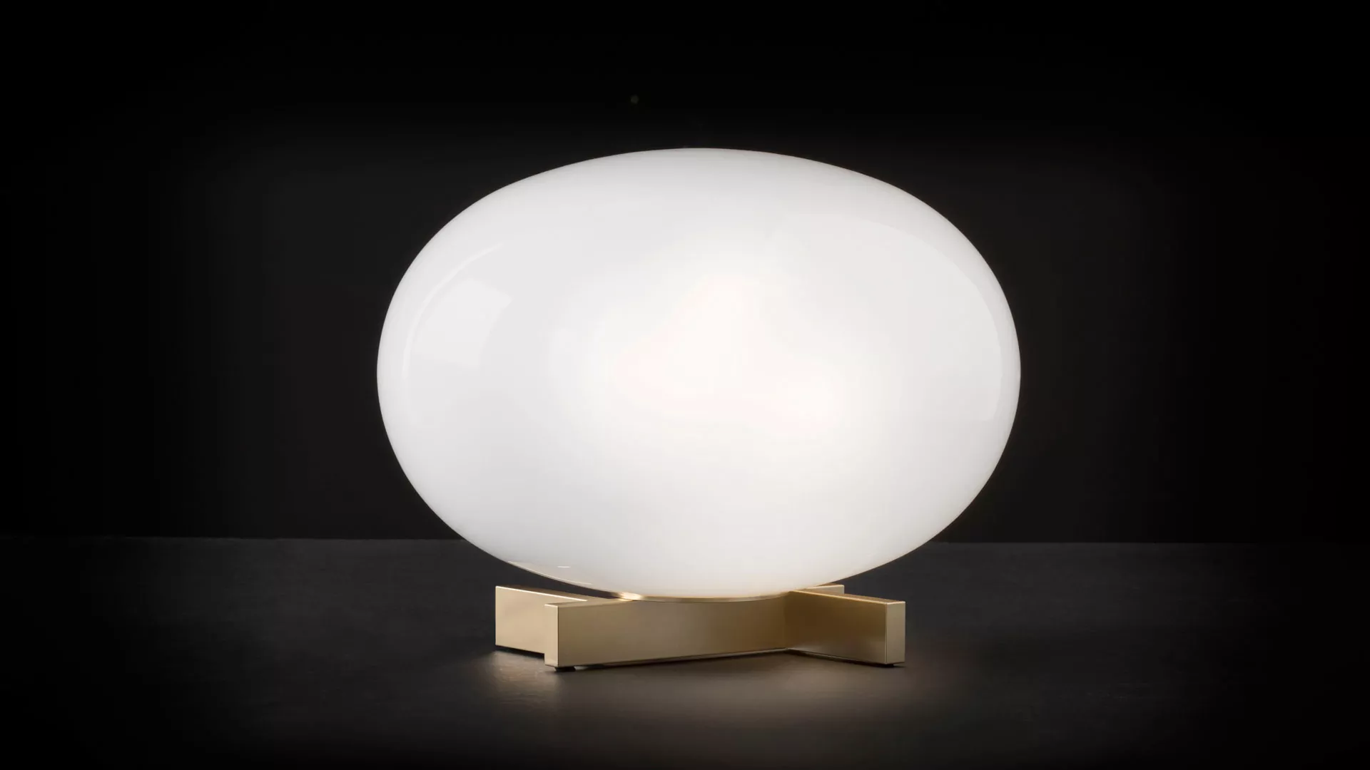 “Alba by Oluce modern Italian table lamp – elegant opal glass globe with minimalist metal base”