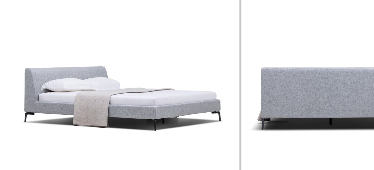 Upholstered platform bed with low profile and padded headboard by Camerichusa.