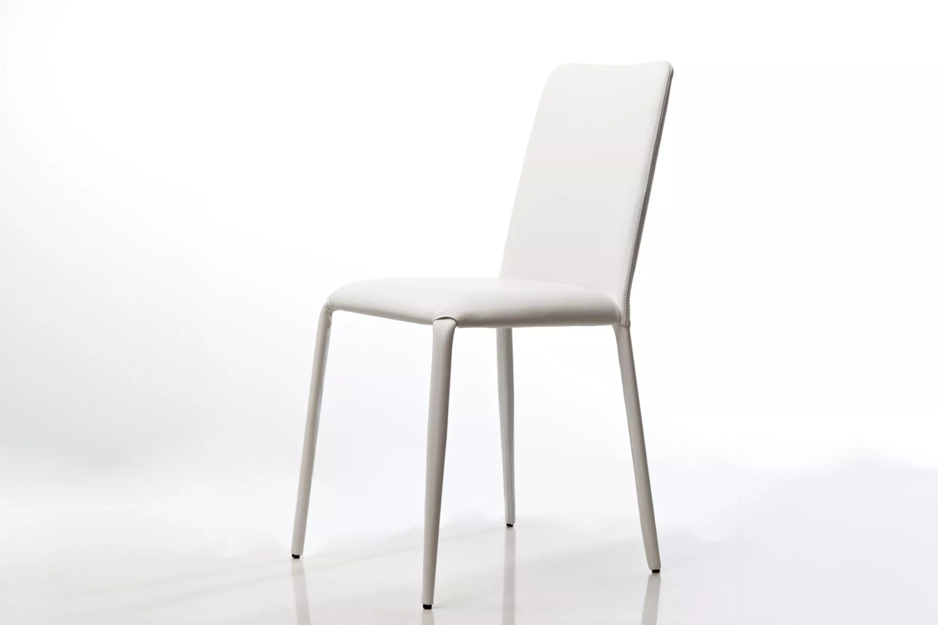 Argo chair by Peressini with smooth, rounded seat shell and slender metal legs in matte black.