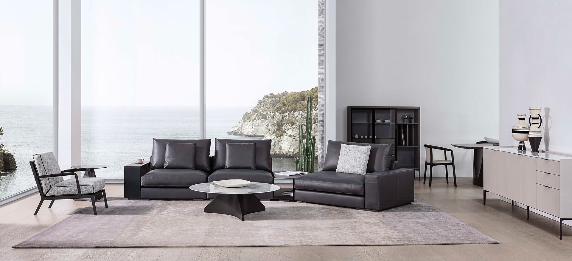 Austen lounge chair with black metal frame and light grey upholstered cushions