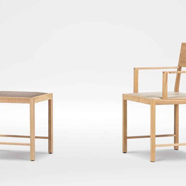 Elegant dining chair with curved back and soft upholstery by Camerich.