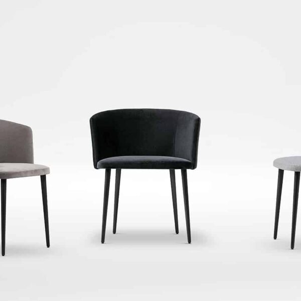 Elegant dining chair with slender legs and soft, padded seat by Camerich.
