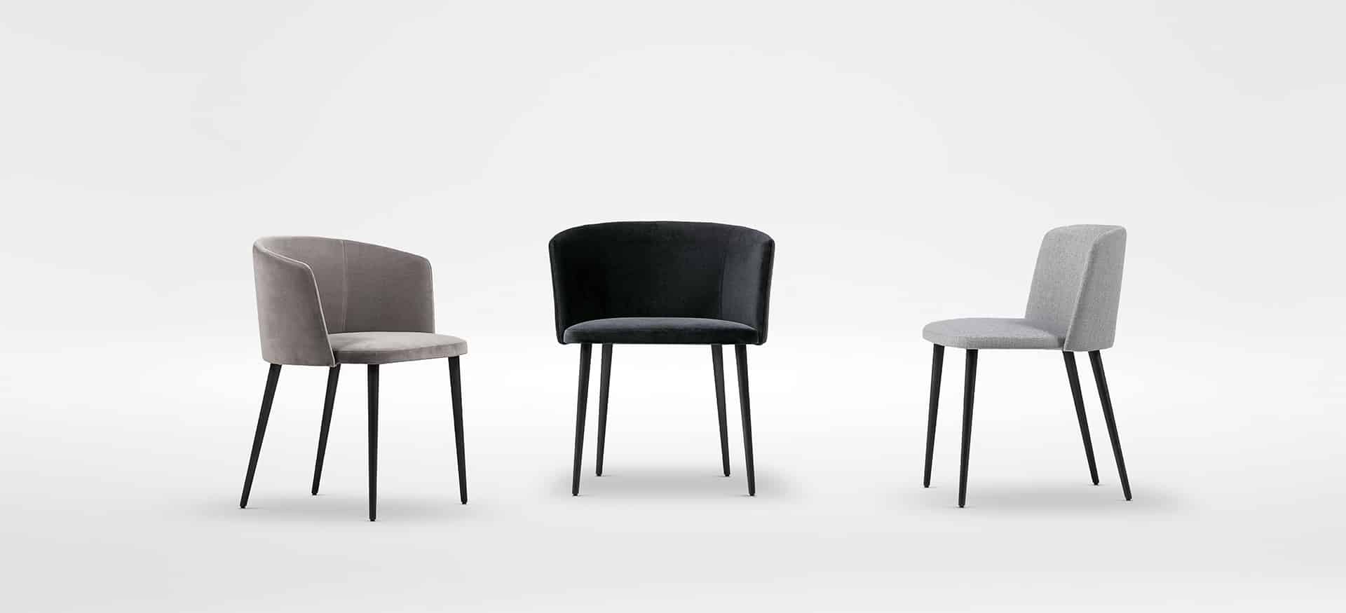 Elegant dining chair with slender legs and soft, padded seat by Camerich.