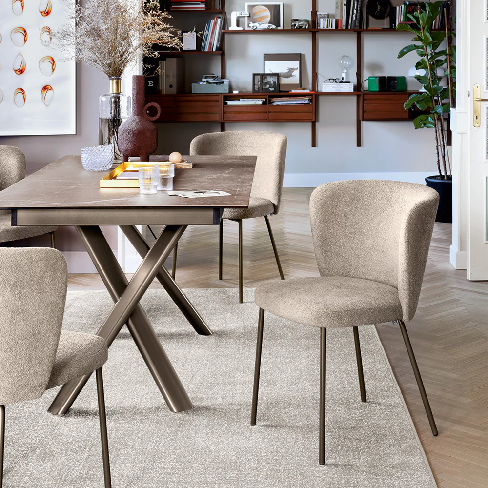 “Side profile of BETTY chair by Connubia – elegant ergonomic design with soft seat and structured silhouette”