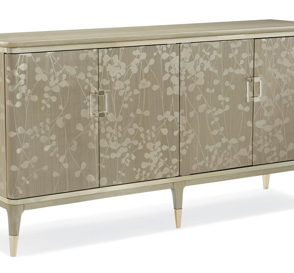 Turn A New Leaf by Caracole — an elegant console table with a leaf-motif metal base and glass top.