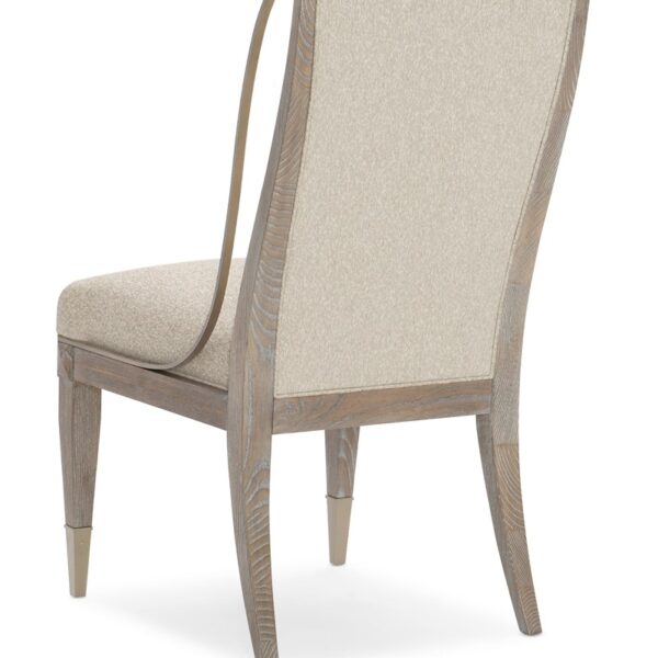 Open Arms Side Chair by Caracole featuring a gently curved backrest and upholstered seat with slender wooden legs.