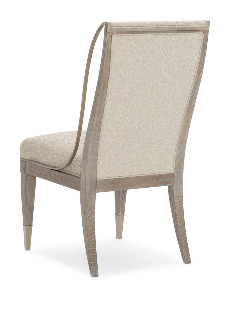 Open Arms Side Chair by Caracole featuring a gently curved backrest and upholstered seat with slender wooden legs.