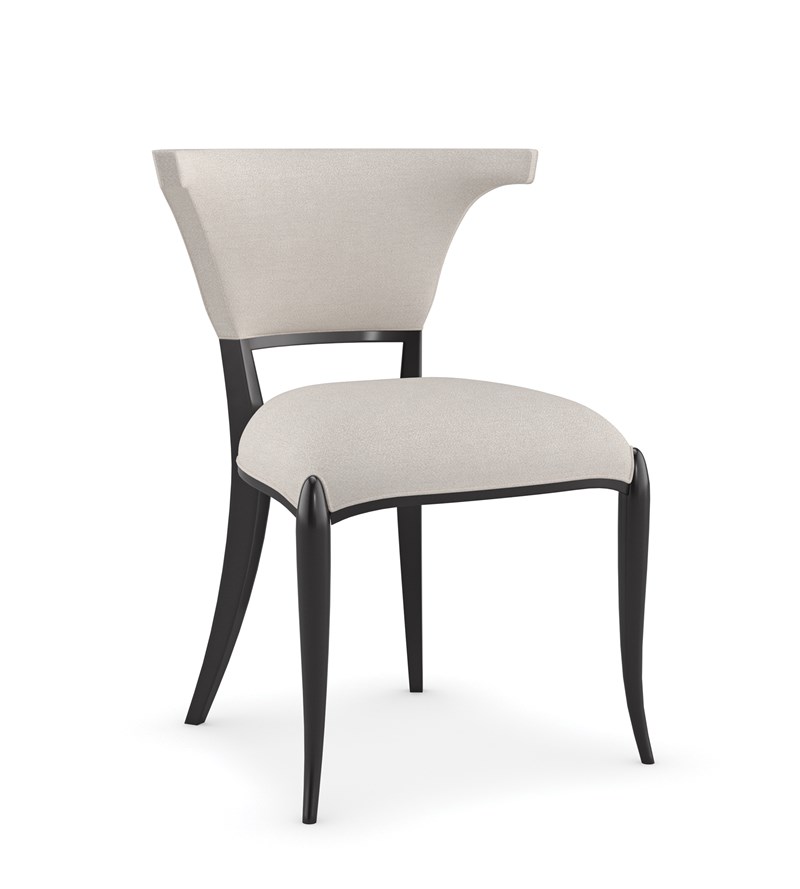 Be My Guest by Caracole — an inviting upholstered chair with curved back and plush seat.