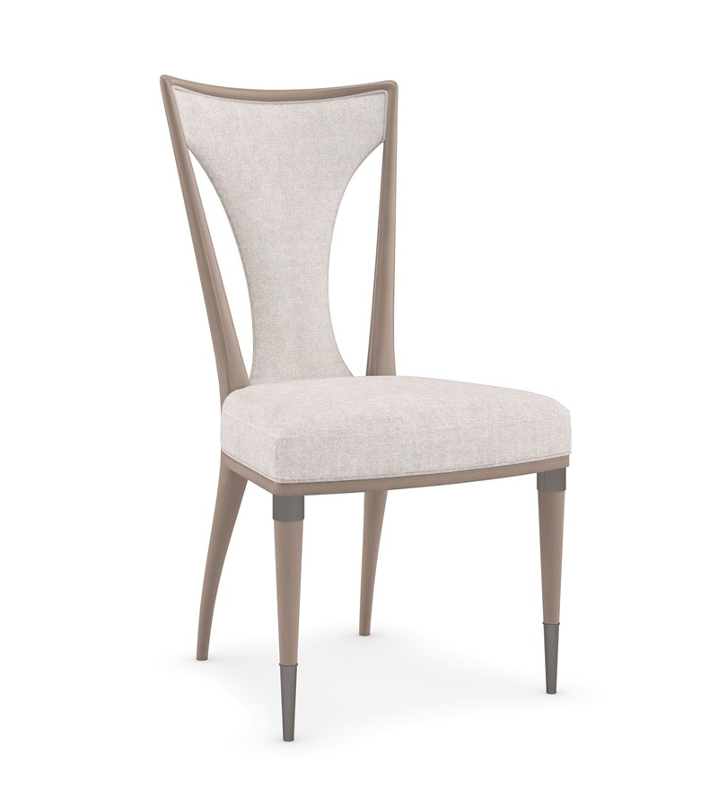 Take Your Seat by Caracole — a refined dining chair with upholstered seat and gently curved backrest.