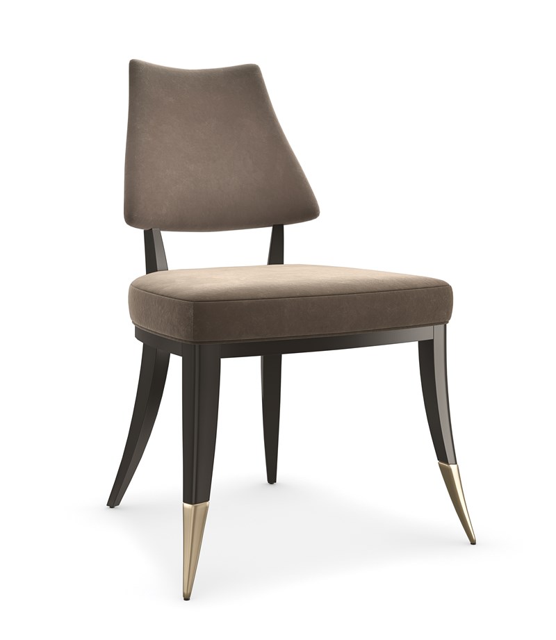 Caress by Caracole — an elegantly curved chair with plush upholstery and a graceful silhouette.