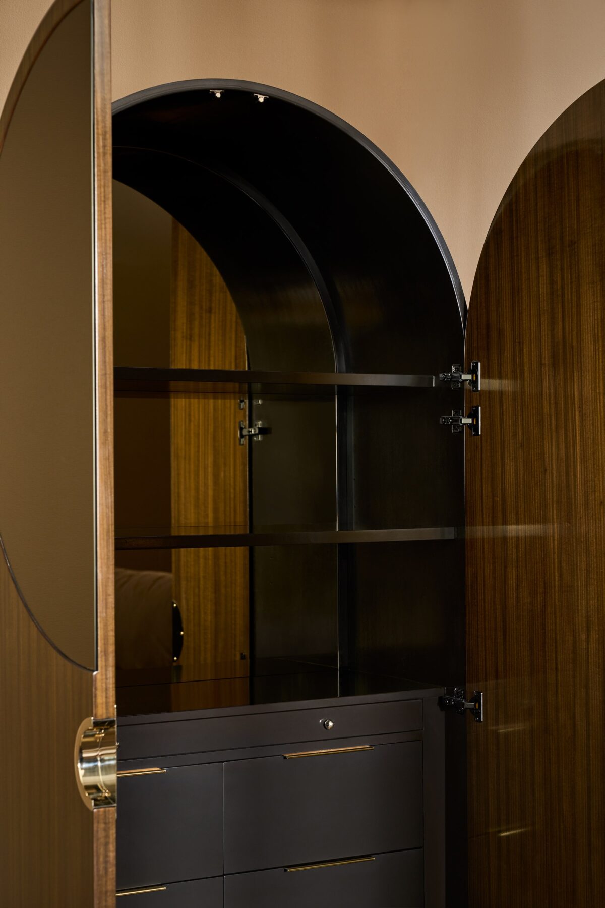Grand GELEE Armoire in Caramello by Caracole, designed with a smooth, reflective surface and discreet hardware, offering luxurious storage with a contemporary flair.