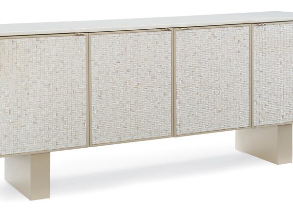 Bomb-Shell by Caracole — a chic barrel-style accent chair with sumptuous upholstery and a gold metal base.