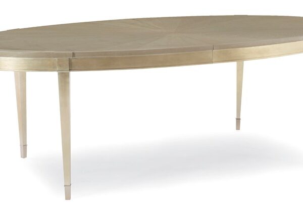 A House Favorite by Caracole — a plush upholstered chair with a curved back and gold metal legs.