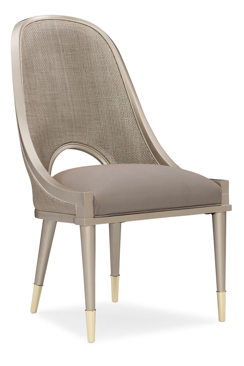Cane I Join You by Caracole — an elegant chair with woven cane panels and upholstered cushions.