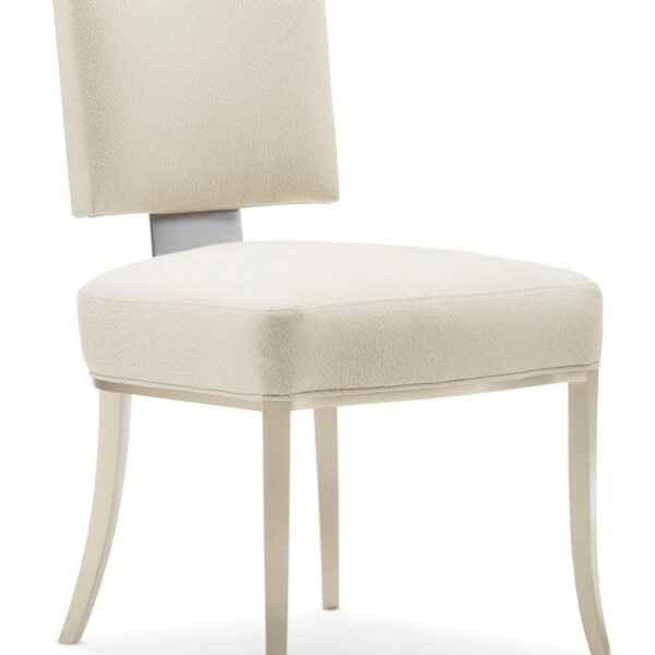 Reserved Seating by Caracole — an elegant dining chair with plush upholstery and a streamlined silhouette.