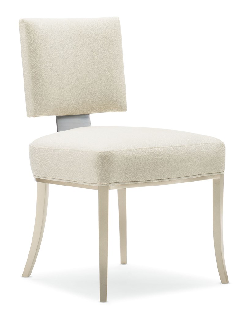 Reserved Seating by Caracole — an elegant dining chair with plush upholstery and a streamlined silhouette.